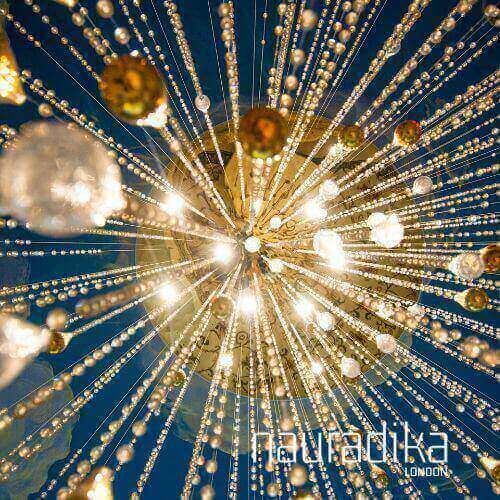 Chandelier exemplifying Use of Warm Light in modern Interior Design with sparkling crystals.