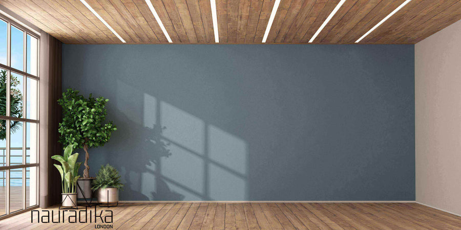 Modern living room showcasing use of negative space in interior design with minimalistic decor and wooden flooring.
