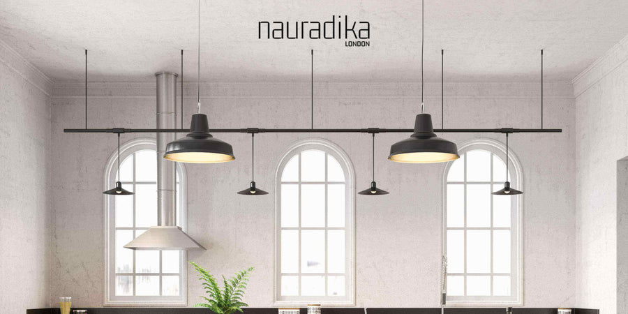 Symmetry creates a feeling of balance and harmony in interior design with black pendant lights in a modern kitchen.