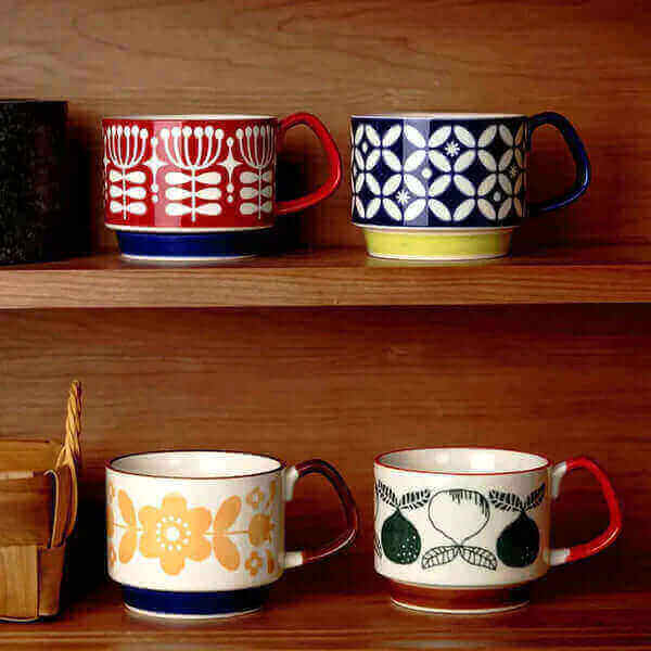 The Trendy Appeal of Retro Coffee Ceramic Cups: A Comprehensive Guide - Colorful vintage mugs on wooden shelf.