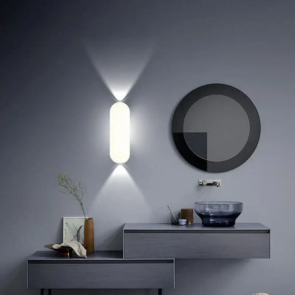 Aluminum Outdoor Modern Nordic Dimmable Wall Lamp illuminating a stylish interior with oval design.