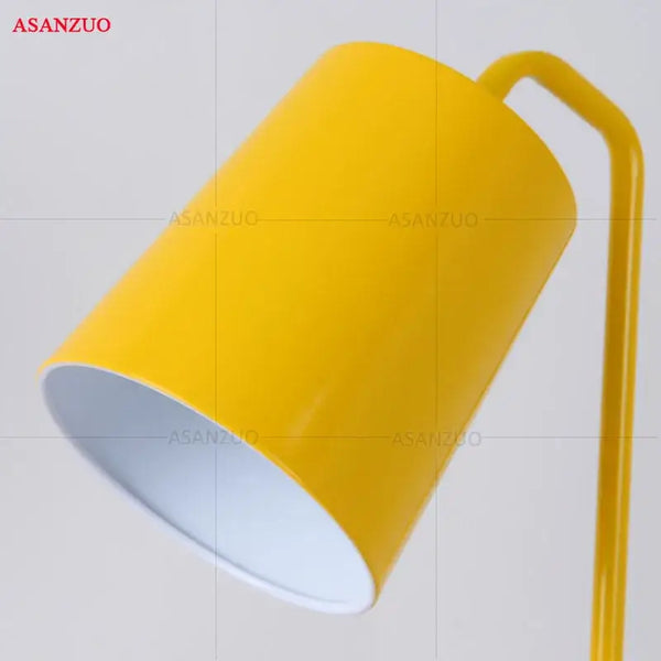 Metal Desk Lamp featuring a vibrant yellow shade and sleek iron structure, ideal for modern decor.