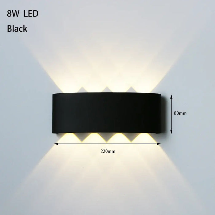 Bathroom Modern Waterproof LED Wall Lamp - Black or White with Gold IP65 in black finish illuminating a wall.