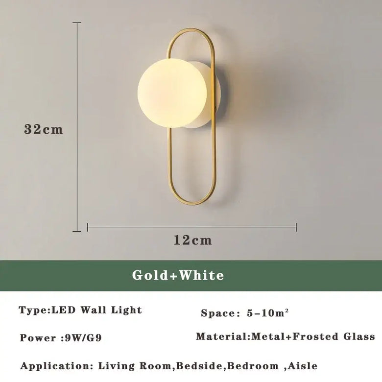 Art Deco Golden Circle Sconce in gold and white, featuring a frosted glass orb for elegant lighting.