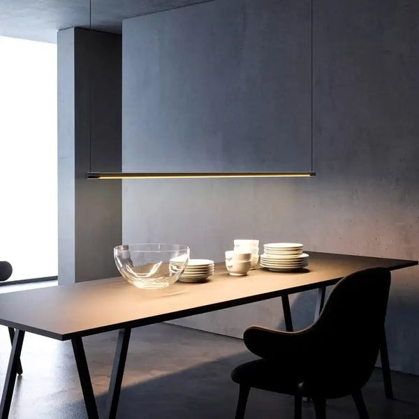 Super Simple Linear Lighting above a modern dining table with minimalist decor and tableware.