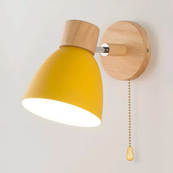 Modern Sconce With Switch, yellow shade wall-mounted light fixture with wooden base and pull chain.