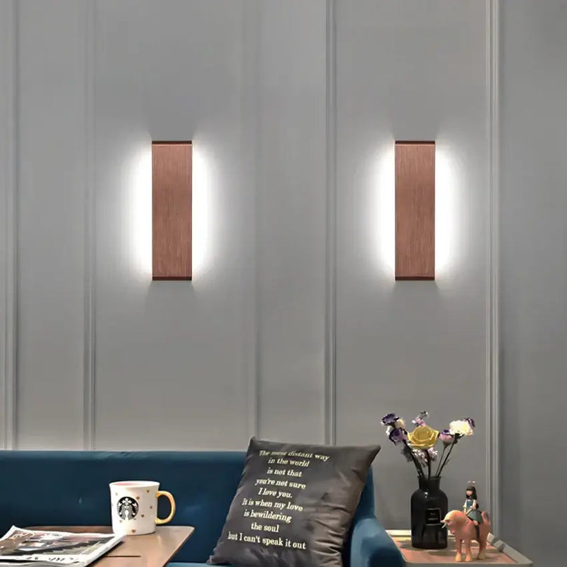 Modern Brushed Gold & Coffee LED Wall Lamp – Sleek Indoor Accent Lighting illuminating a stylish living room.