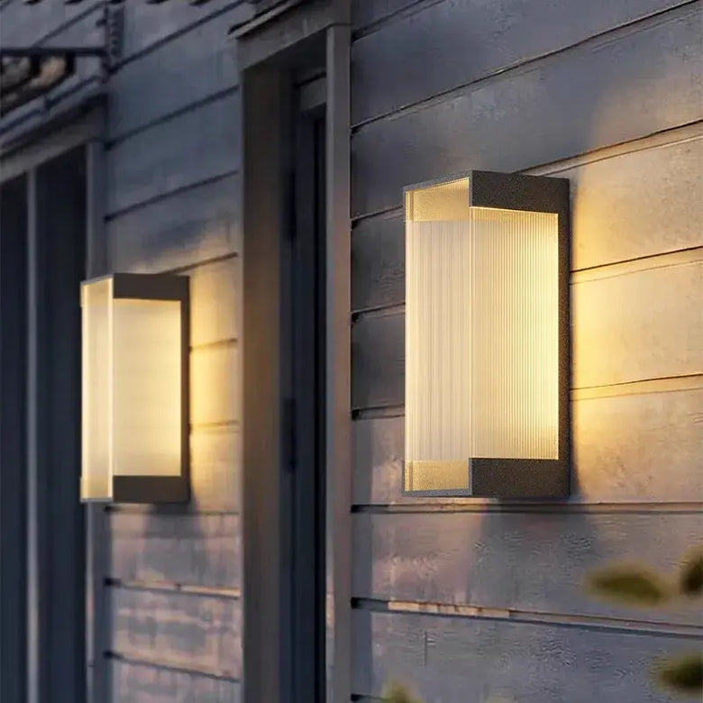 Modern Outdoor Waterproof Stainless Steel Wall Light – Warm & Cool White illuminating a house exterior.