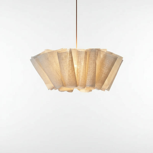 Hero Fabric pleated Chandelier hanging above a wooden dining table, providing warm Scandinavian lighting.