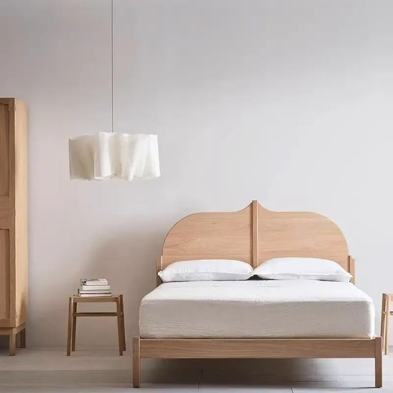 Off-White Pendant Light made from Natural Plant Fiber hanging over a cozy wooden bed in a minimalist bedroom.