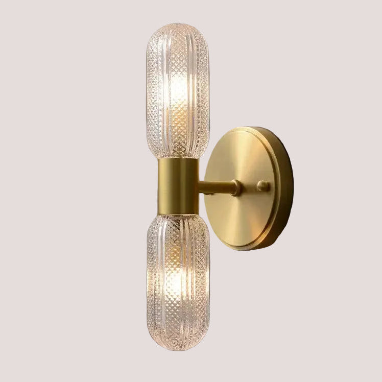featuring sleek gold finish and elegant glass design for modern lighting.