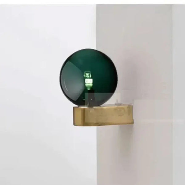 Chic Dual Bubble Wall Light - Modern & Versatile Lighting featuring a green bubble and brass base.