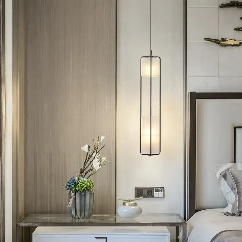 White Glass & Metal Art Deco Chandelier illuminating a stylish bedroom with elegant decor.