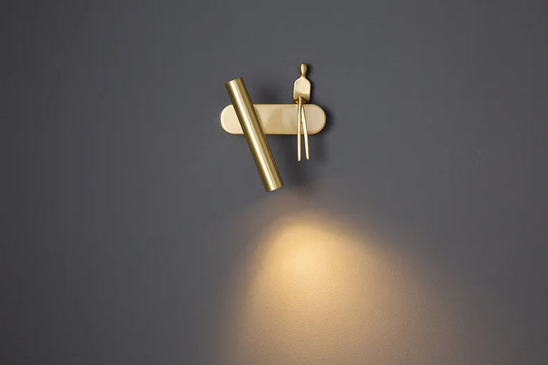 Minimalist Wall mounted Light with Seated human figure, Gold/Black