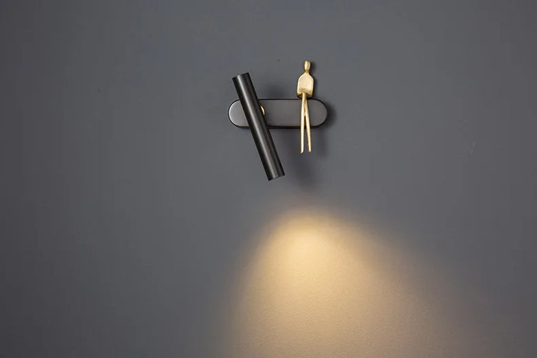 Minimalist Wall mounted Light with Seated human figure, Gold/Black