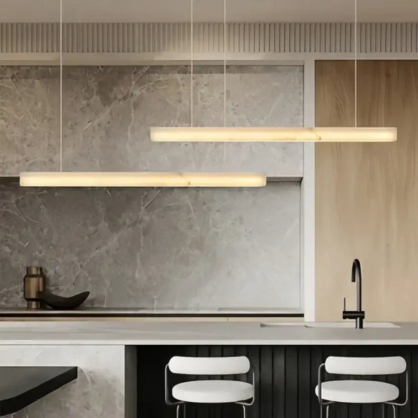 Natural Marble Linear Pendant Light 80–120cm hanging over a modern kitchen island with a sleek design.