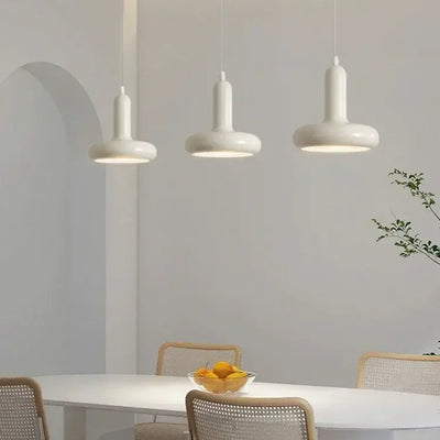 60s Scandinavian Style Kitchen Pendant Lamp in cream color illuminating a modern kitchen table with stylish decor.