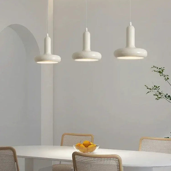 60s Scandinavian Style Kitchen Pendant Lamp in cream color illuminating a modern kitchen table with stylish decor.