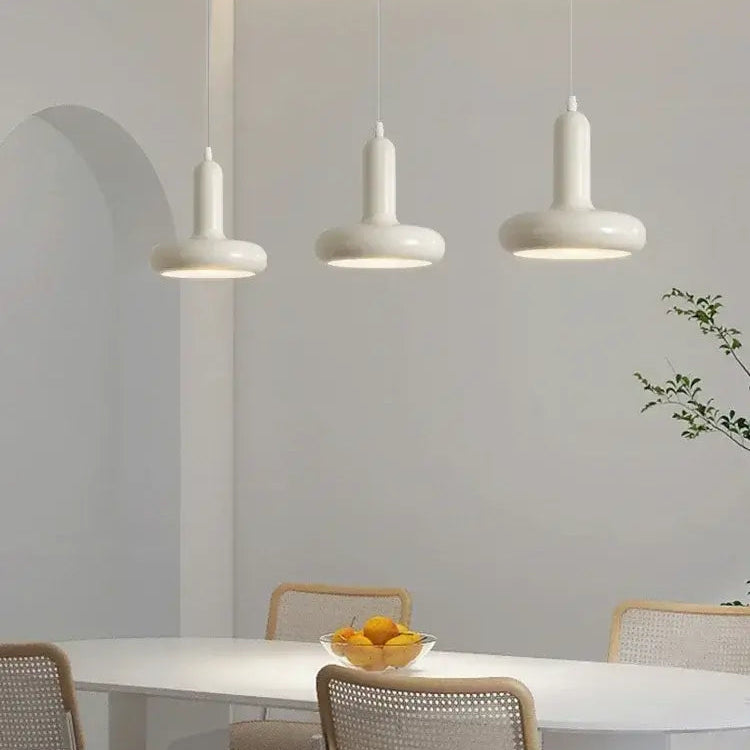 60s Scandinavian Style Kitchen Pendant Lamp in cream color illuminating a modern kitchen table with stylish decor.
