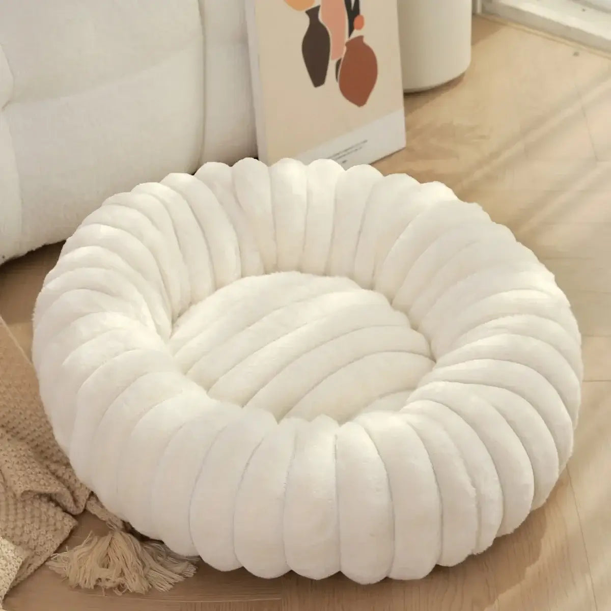 Donut Dog Bed in Multiple Sizes and Colours, plush cream faux fur, anti-slip bottom, perfect for stylish interiors and pet comfort.