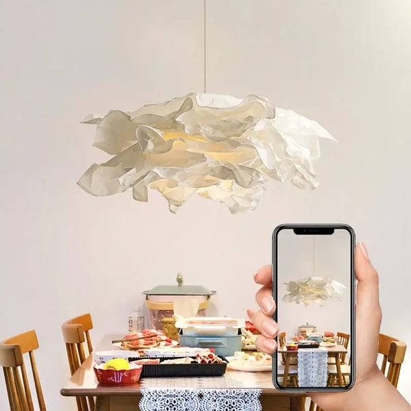 Cloud Like Paper Lamp Shade up to 70cm wide hanging above a dining table, adding a whimsical touch.