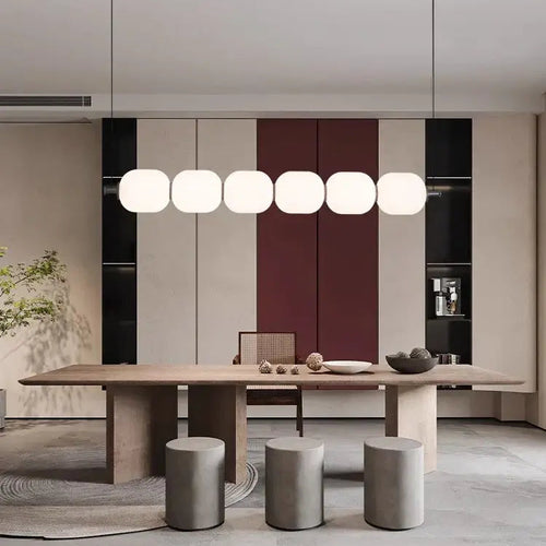 Modern Diffused Light Strip Pendant | Elegant Lighting Solution above a contemporary dining table setting.