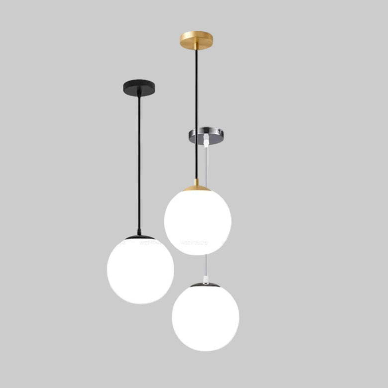 hero Modern pendant light with three spherical white shades on a plain background