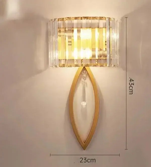 Unique Collection of Art Deco Sconces featuring chic design and elegant gold and crystal elements.