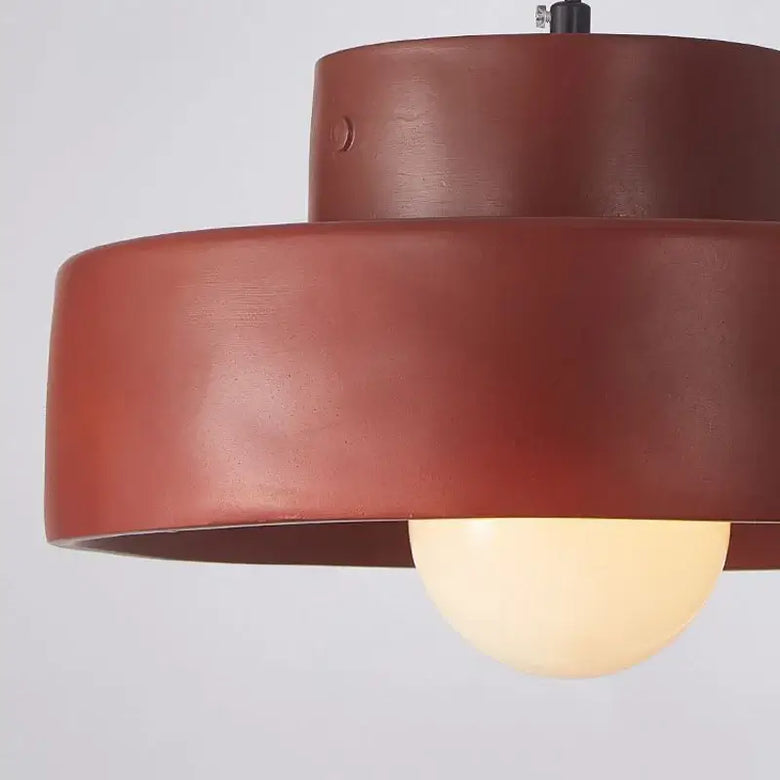 Illuminate Your Space with the Minimalist Nordic Resin Pendant Light - modern design in warm tones.