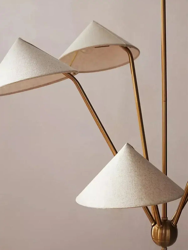 Chic Japansese Mid-Century Modern Ceiling Pendant featuring golden rods and elegant fabric shades.