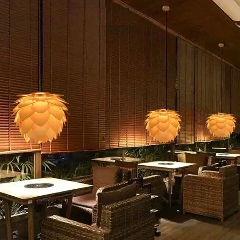 Wooden Pinecone Pendant Light - Nordic Art Inspired Home Lighting illuminating a stylish cafe interior.