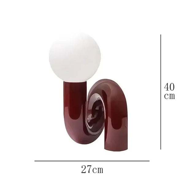 Sculptural Resin Table Lamp – Italian-Inspired Modern Lighting featuring a polished resin design and frosted glass globe.