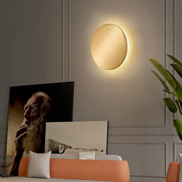 Wall Lamp: Modern Copper Round illuminating a stylish room with warm light and artistic decor.