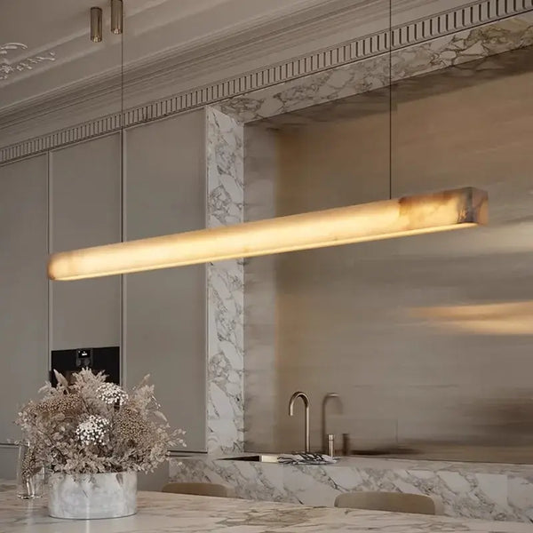Natural Marble Linear Pendant Light 80–120cm above a kitchen island with marble backsplash.