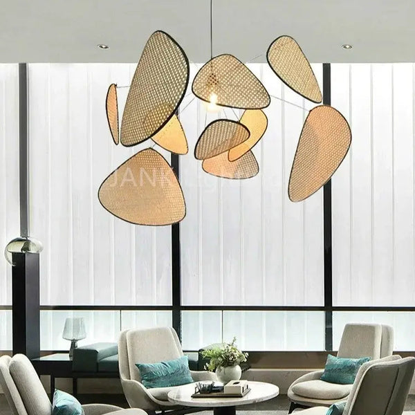 Mid-Century Modern Rattan Wall Light hanging in a contemporary living room with modern furniture and large windows.