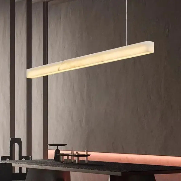 Natural Marble Linear Pendant Light 80–120cm illuminating a modern dining space.