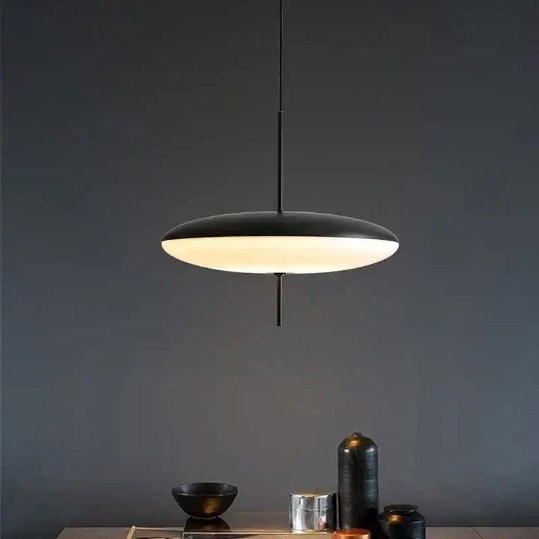 Nordic LED Pebble Pendant Light – Minimalist Ceiling Lamp hanging over a stylish dining table with sleek decor.