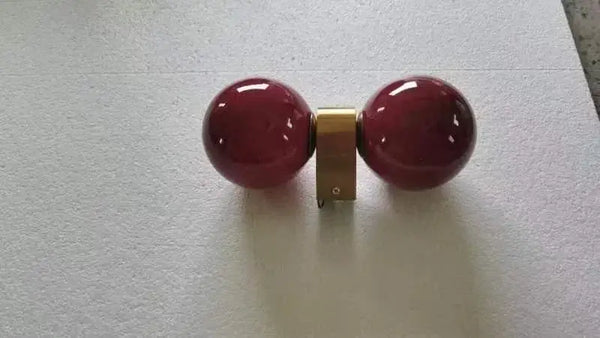 Chic Dual Bubble Wall Light - Modern & Versatile Lighting with polished brass and playful color balls.