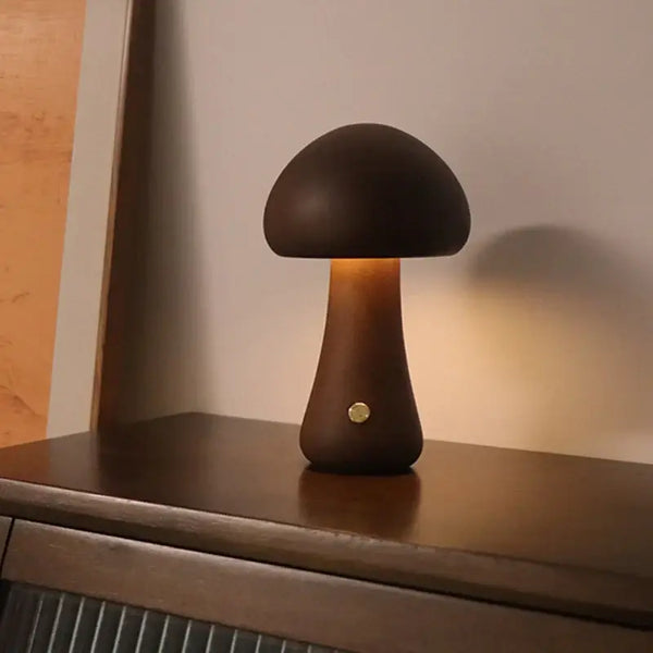 Portable Dimmable 60s Italy Designer Mushroom Table Lamp glowing on a wooden surface. Perfect for travel and adjustable brightness.