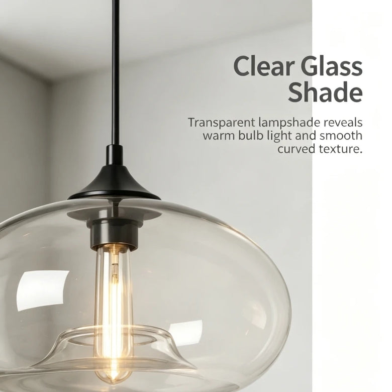 Close-up of a clear glass dome pendant shade with a filament bulb