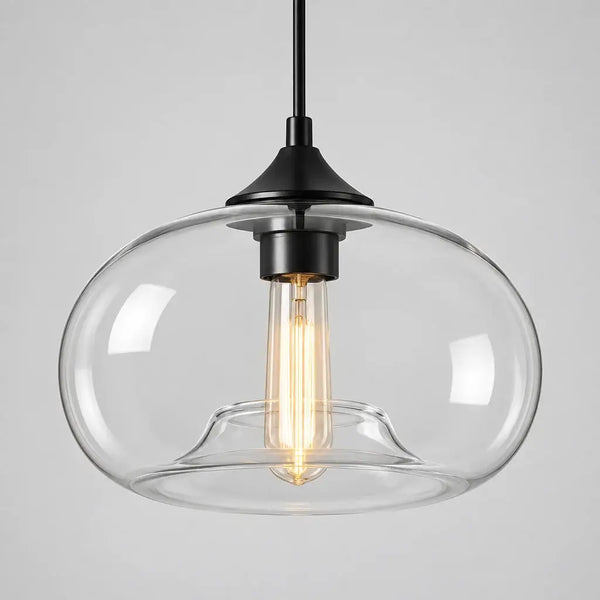 Nordic minimalist glass dome pendant light with a black cable and ceiling plate on a neutral wall
