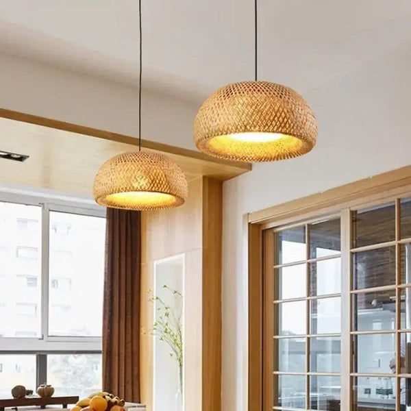 Chic Mid-Century Rattan Chandeliers hanging in a modern dining space, showcasing woven rattan design and warm light.
