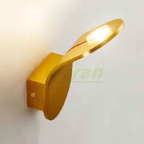 Wall Lamp: Mid-Century Modern Japanese Style in a sleek gold finish, featuring a leaf-inspired design.