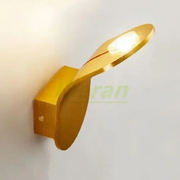 Wall Lamp: Mid-Century Modern Japanese Style in a sleek gold finish, featuring a leaf-inspired design.