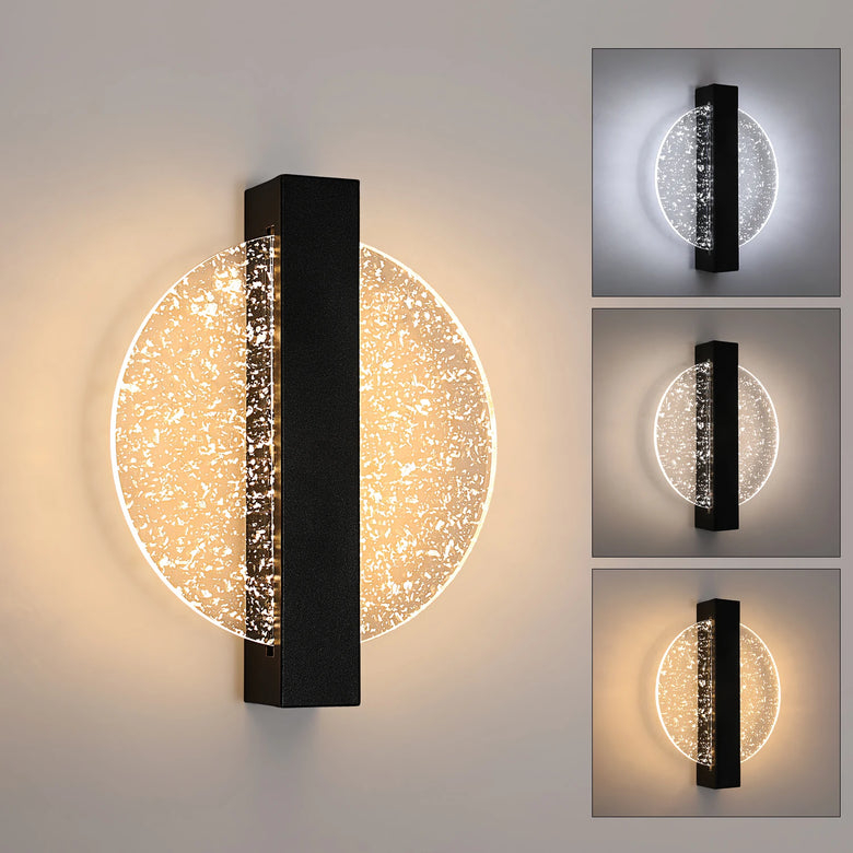 Modern wall sconce light fixture with a vertical black rectangular bar and a circular clear textured globe that glows warm white, shown on a light wall with three smaller inset views showing different light modes.