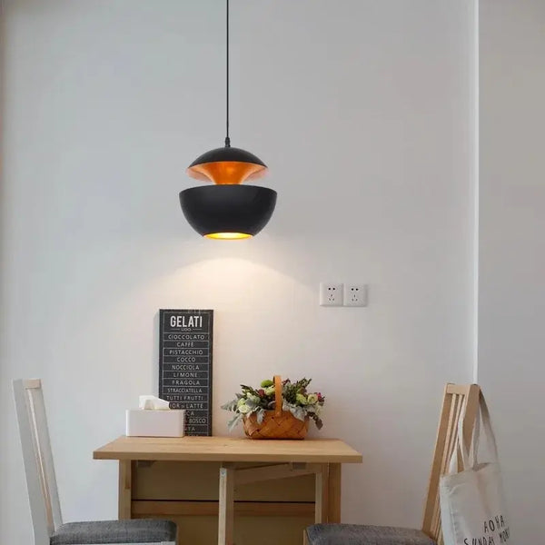 Kitchen Island Scandi Pendants in a modern dining space with minimalist design and warm lighting.