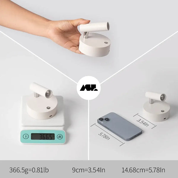 USB Recharge Wall Mounted Spotlight displayed alongside its weight and dimensions on a digital scale and next to a smartphone.
