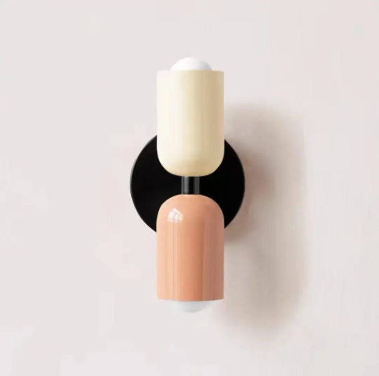 Hero Wall sconce with two-tone design on a light gray background