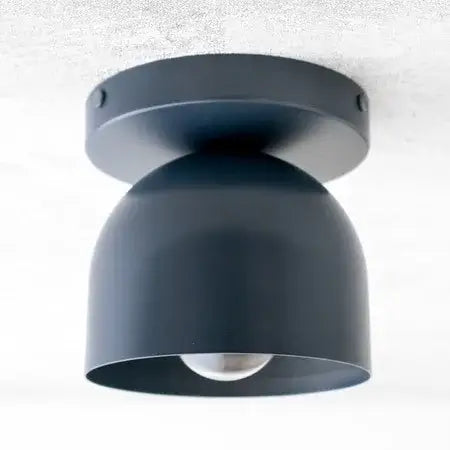 Compact Iron Ceiling Light with Dome Shade illuminating a modern space with its sleek, understated design.