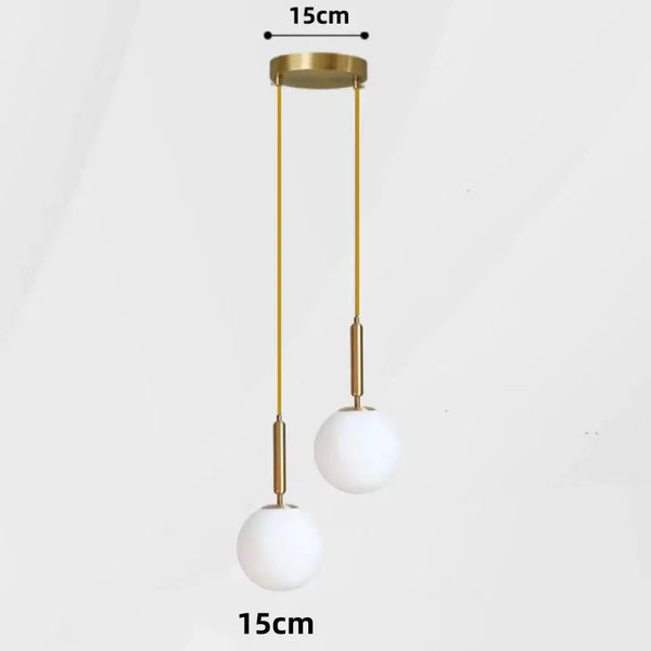 Modern Gold Glass Ball Pendant featuring sleek design with two white glass bulbs and adjustable golden suspension.